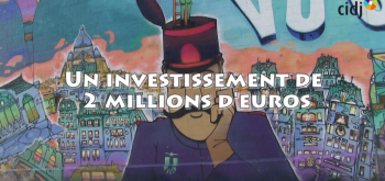 Titre de la vidéo "un investissement de 2 millions d'euros". En fond, un graffiti sur un mur.